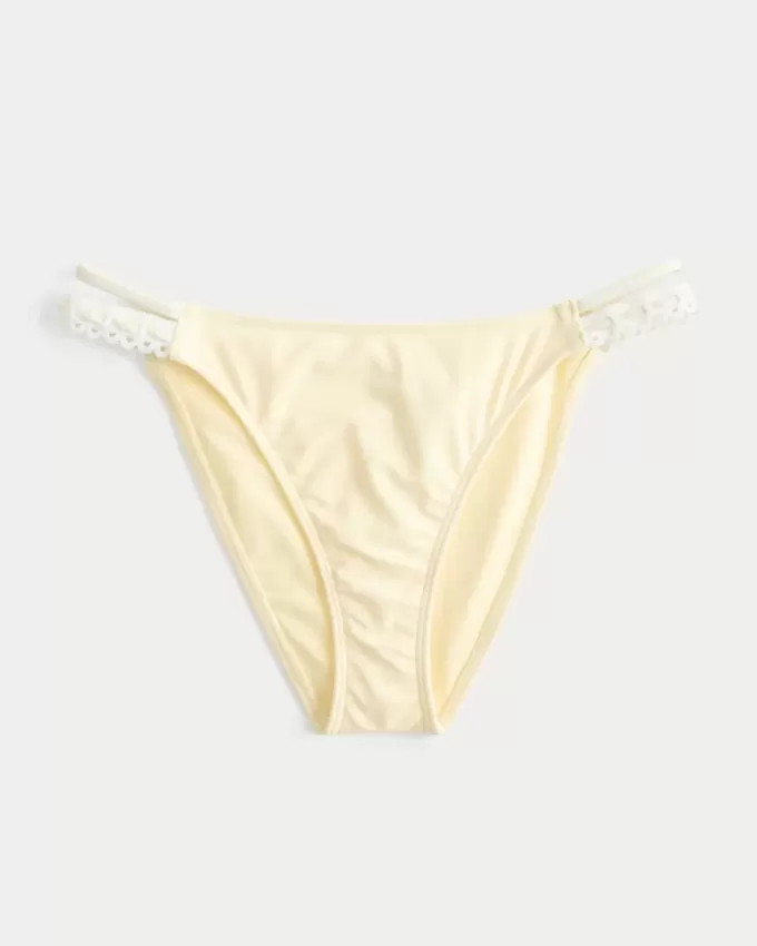 Cheeky bikinibroekje met haak-stijl rand en dubbele bandjes Cheeky bikinibroekje met haak-stijl rand en dubbele bandjes