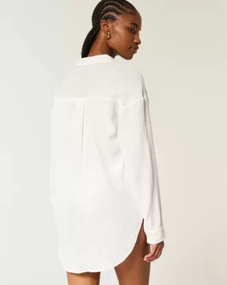 Mini-jurk met gaas en knoopjes Mini-jurk met gaas en knoopjes