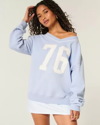 Oversized sweatshirt met grafische V-hals en cijfers Oversized sweatshirt met grafische V-hals en cijfers